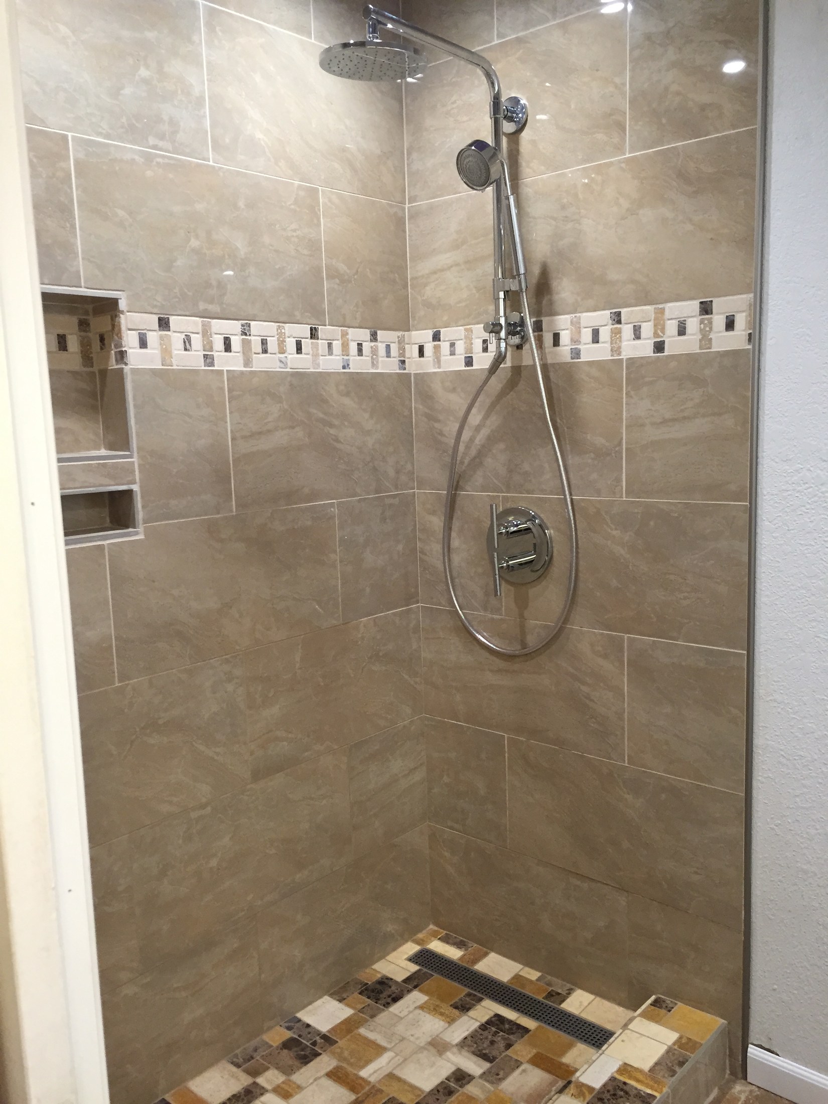 Finished walk-in shower tile and fixtures by 360 Construction JN