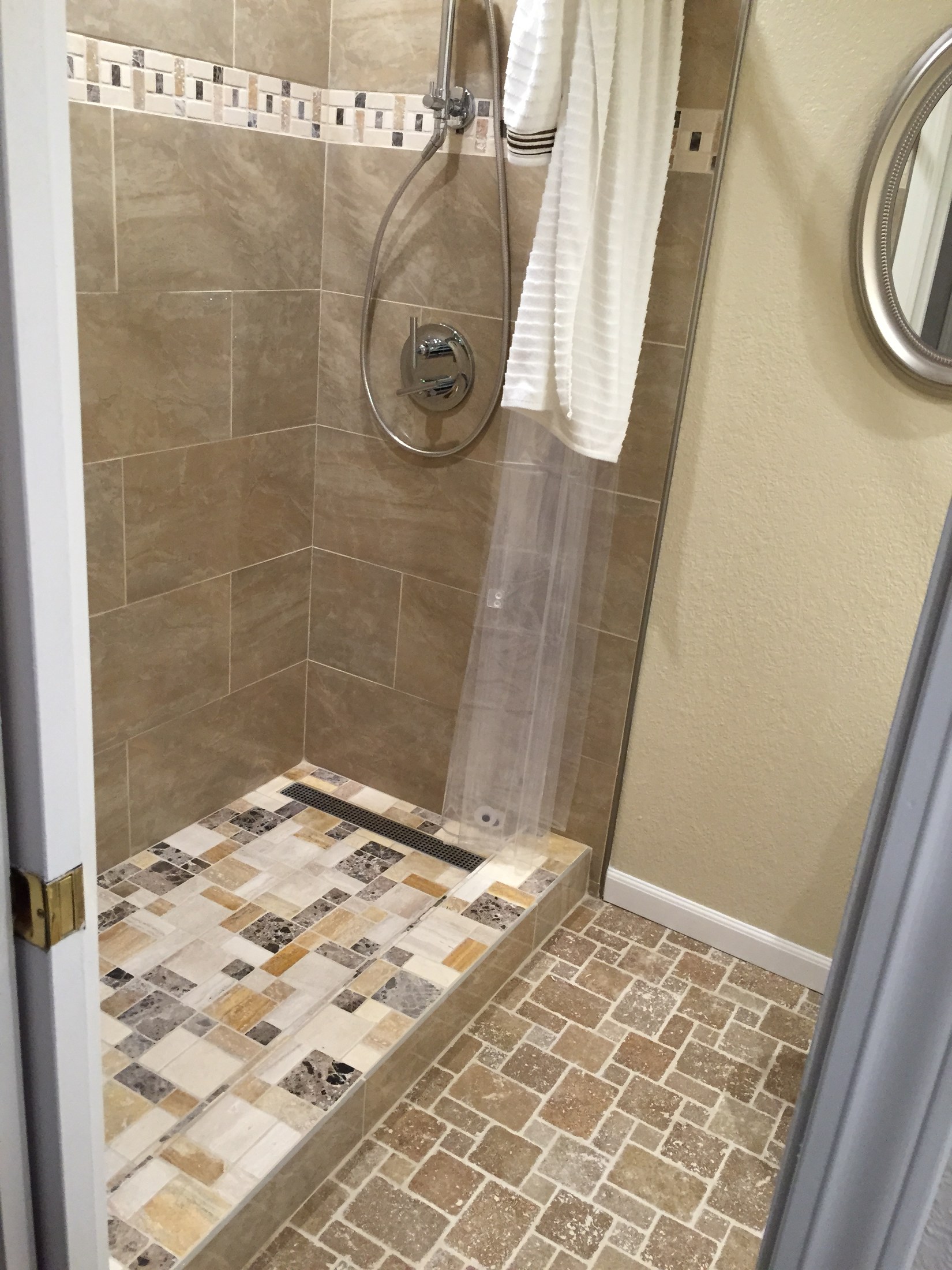Finished tiled shower with bench by 360 Construction JN