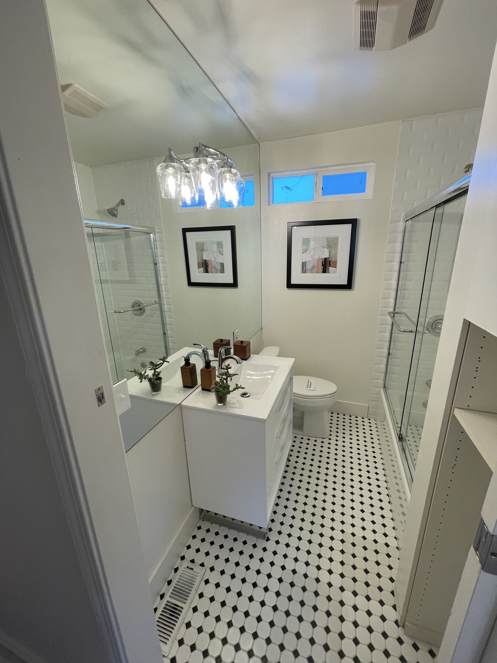 Finished bathroom vanity and shower by 360 Construction JN