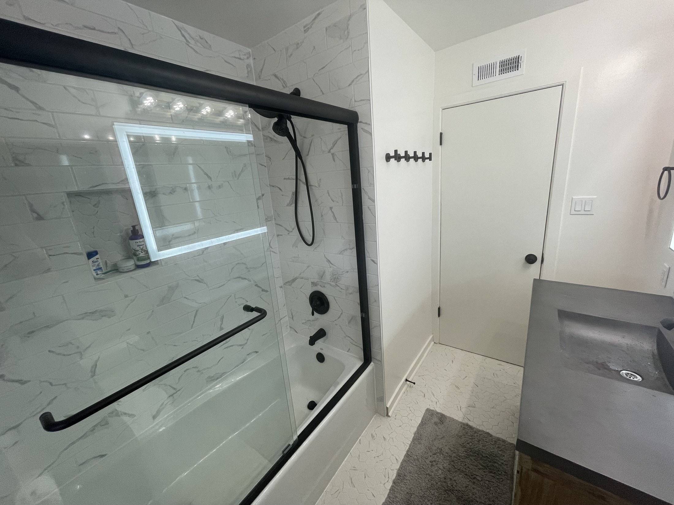 Finished bathroom shower and tile work by 360 Construction JN