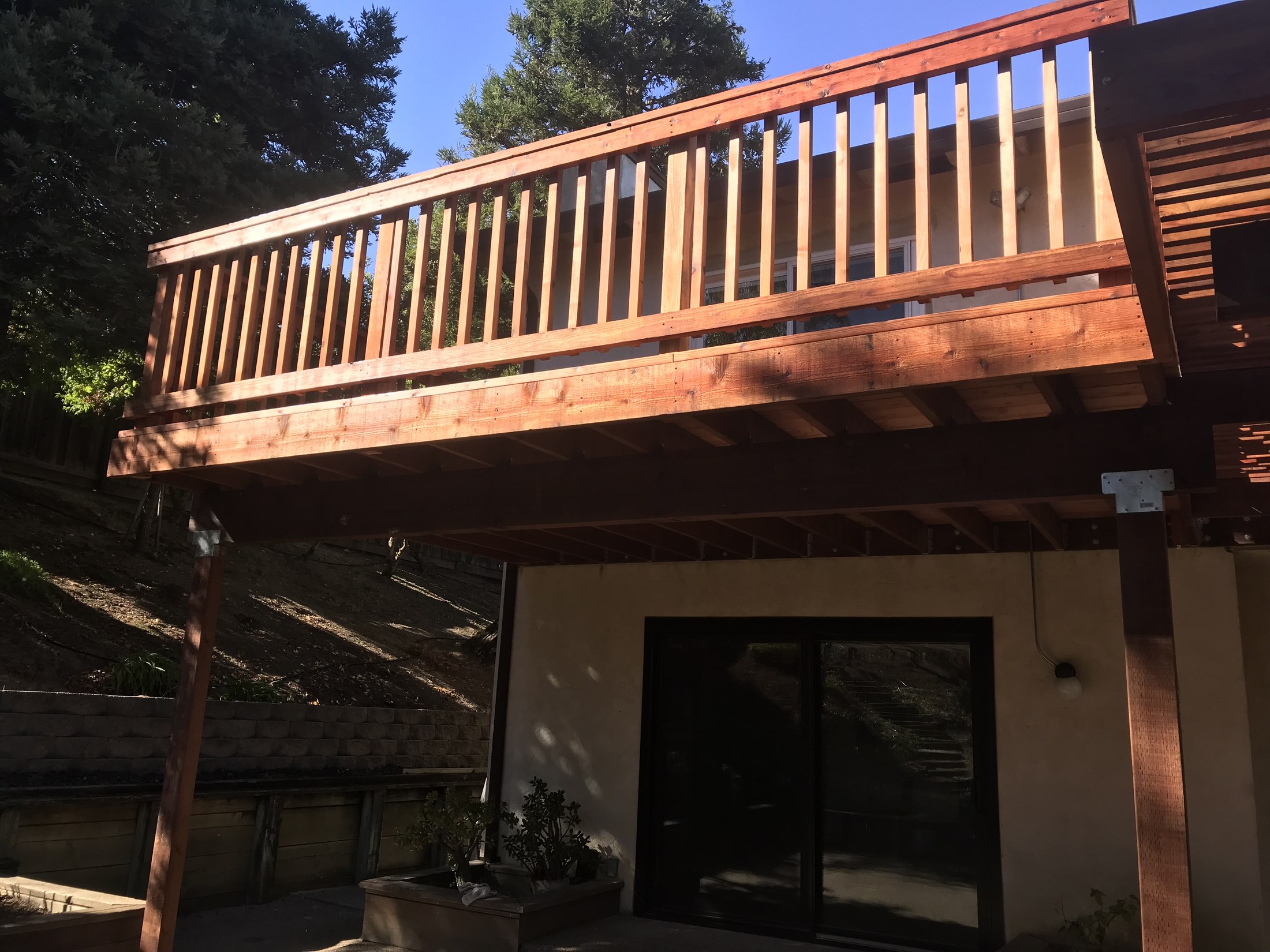 Completed exterior deck and railing by 360 Construction JN