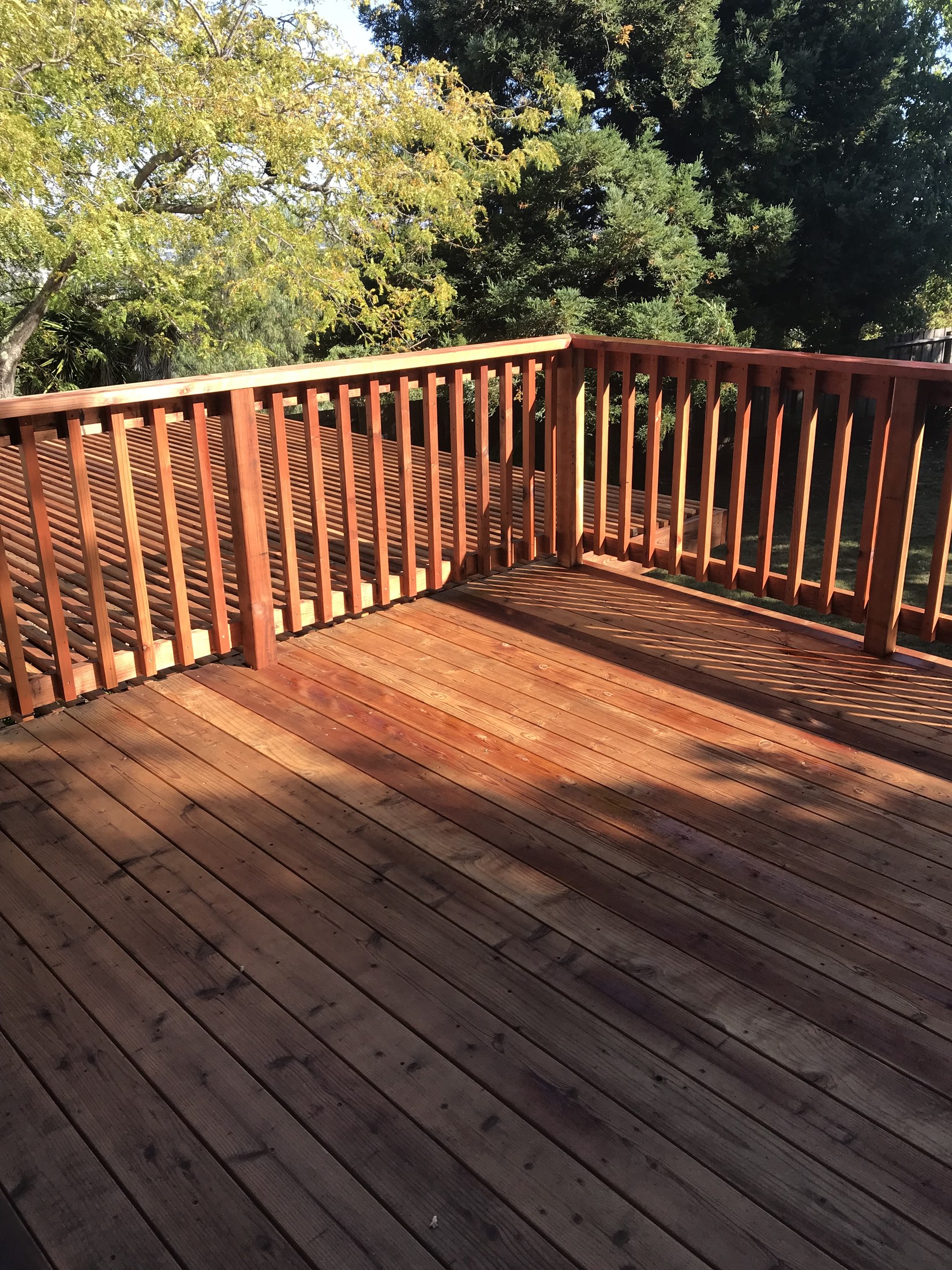 Finished deck surface and railing by 360 Construction JN