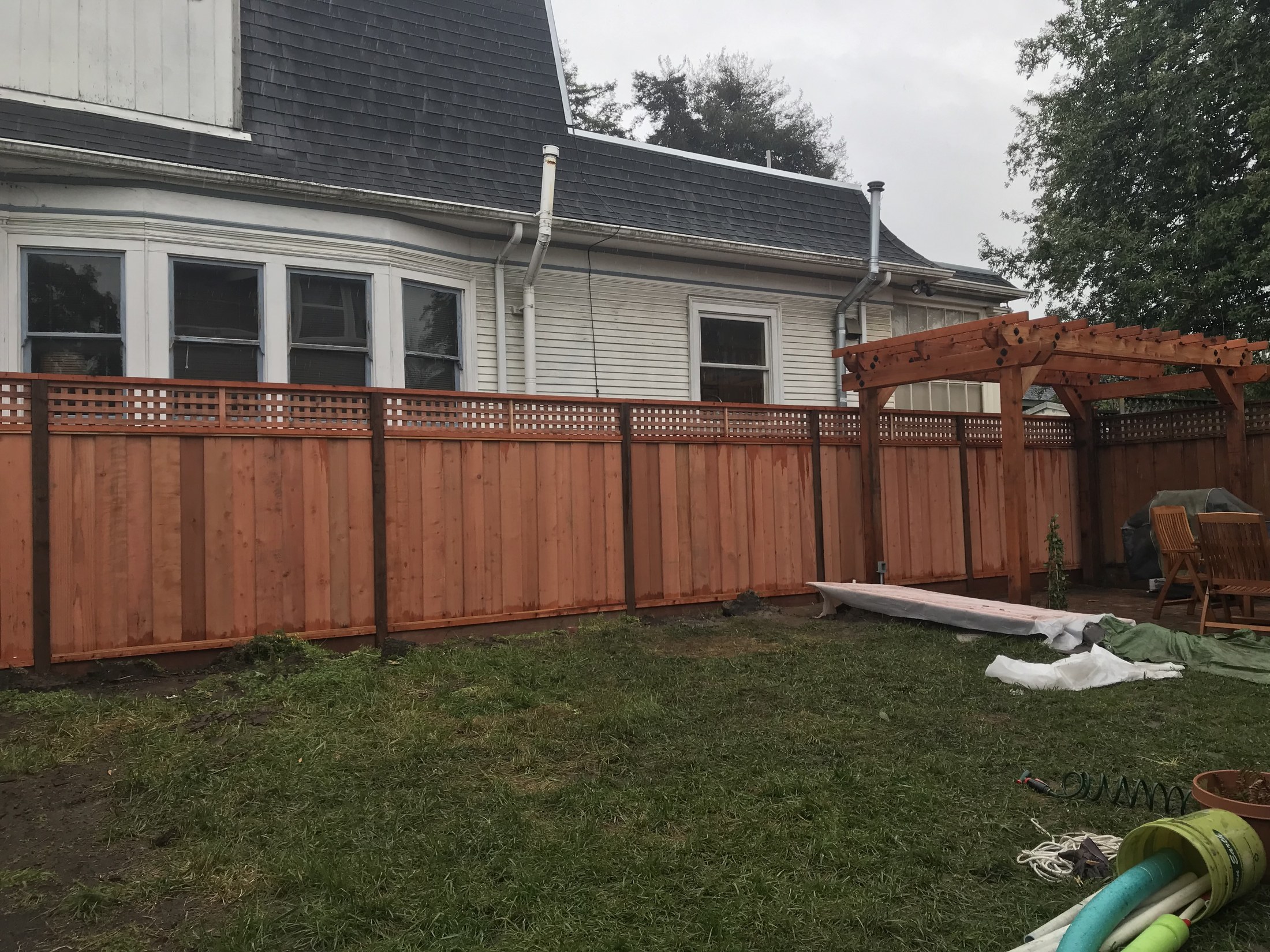 Finished backyard fence and pergola area by 360 Construction JN