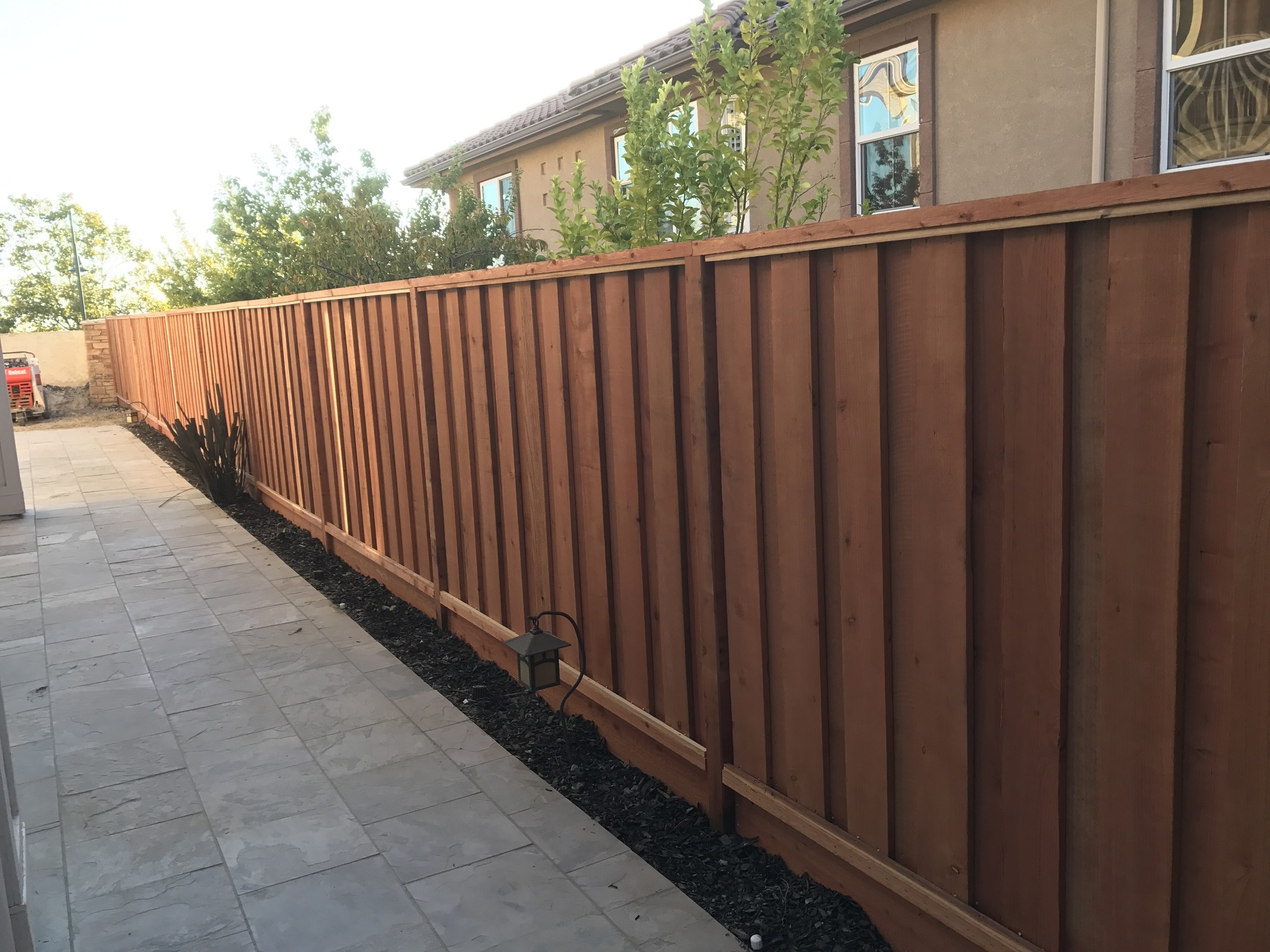 Finished long wood fence installation by 360 Construction JN