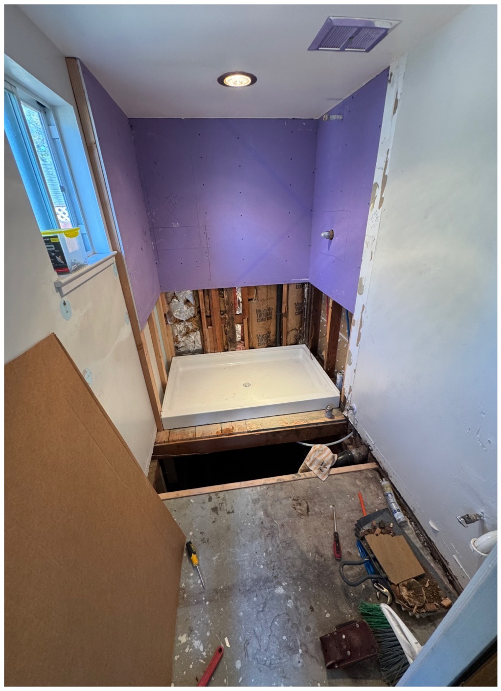 Bathroom remodel before with shower area under construction