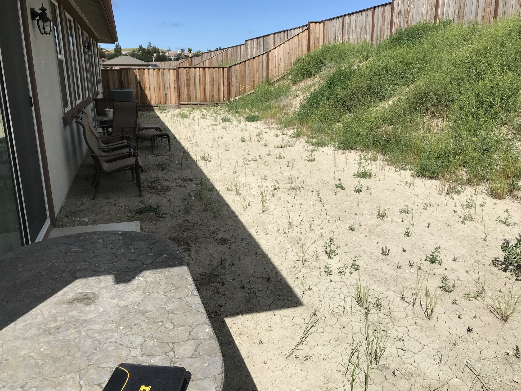 Backyard before concrete patio work by 360 Construction JN