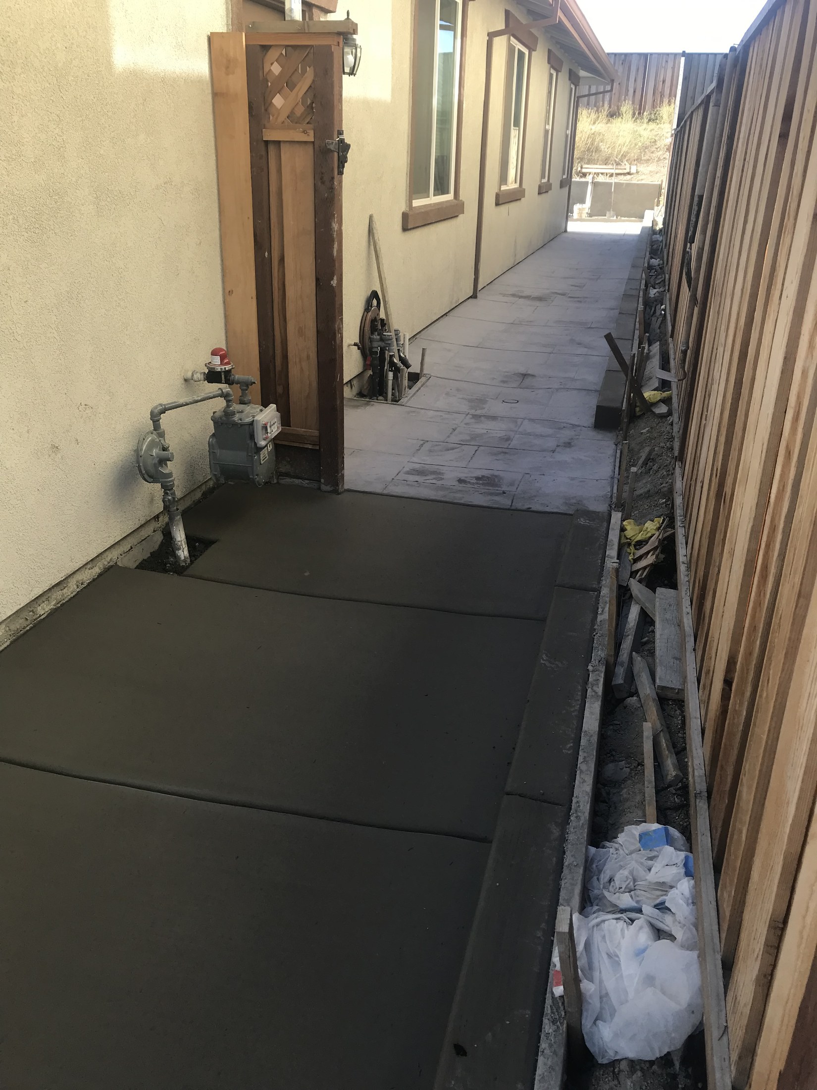 Finished side-yard concrete walkway by 360 Construction JN